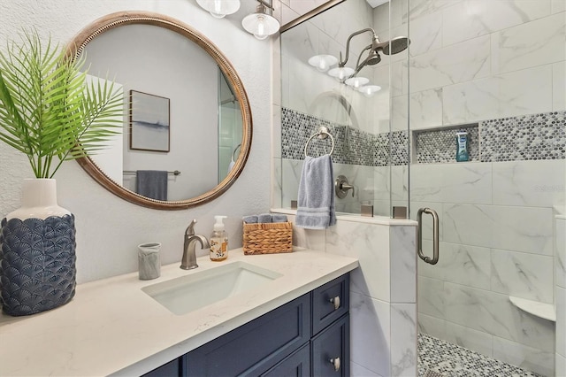 bathroom with vanity and an enclosed shower