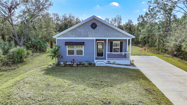 view of front of home with a front lawn and a porch