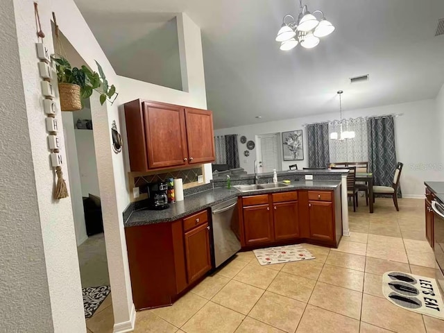 kitchen featuring a notable chandelier, dishwasher, sink, and hanging light fixtures