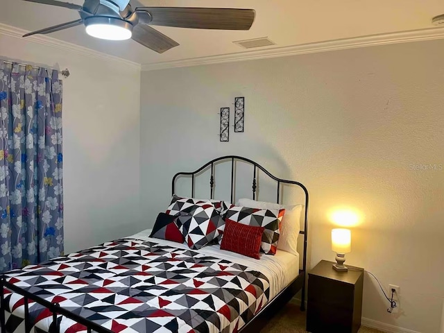 bedroom with ceiling fan and ornamental molding