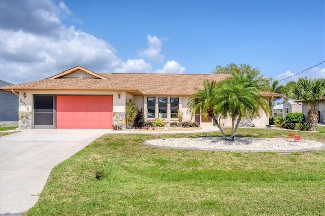 ranch-style home featuring a garage and a front lawn