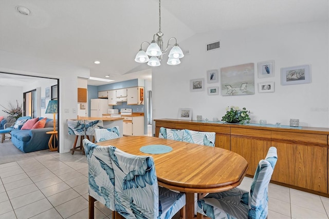 dining space with visible vents, vaulted ceiling, recessed lighting, light tile patterned flooring, and a notable chandelier