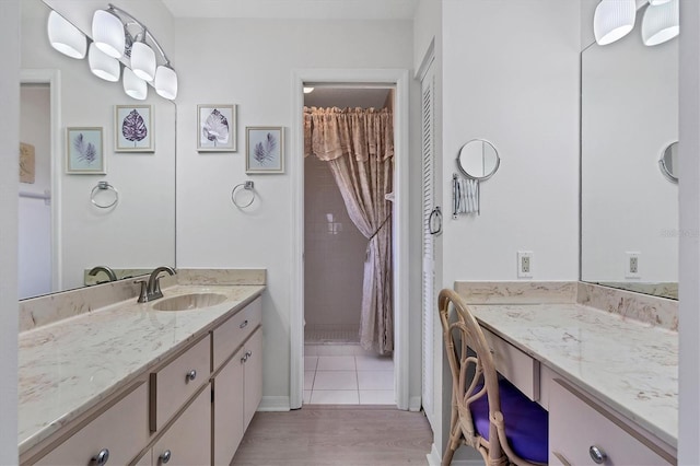 bathroom featuring vanity and hardwood / wood-style flooring