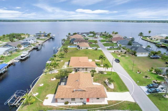 drone / aerial view with a water view