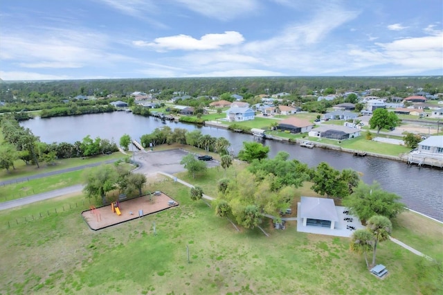 birds eye view of property featuring a water view