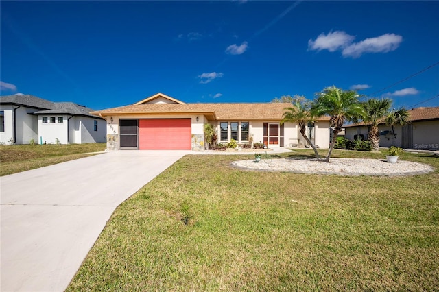 ranch-style home with a front yard, concrete driveway, a garage, and stucco siding