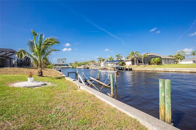 dock area featuring a residential view, a water view, and a lawn