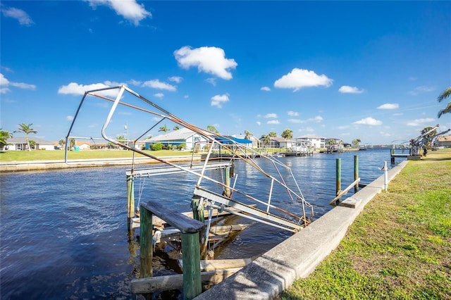 view of dock with a water view and boat lift