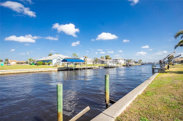 dock area featuring a residential view and a water view