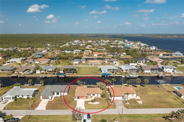 aerial view featuring a residential view and a water view