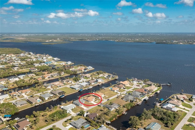 bird's eye view with a residential view and a water view