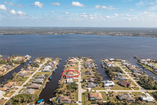 bird's eye view with a residential view and a water view