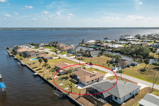 birds eye view of property with a residential view and a water view