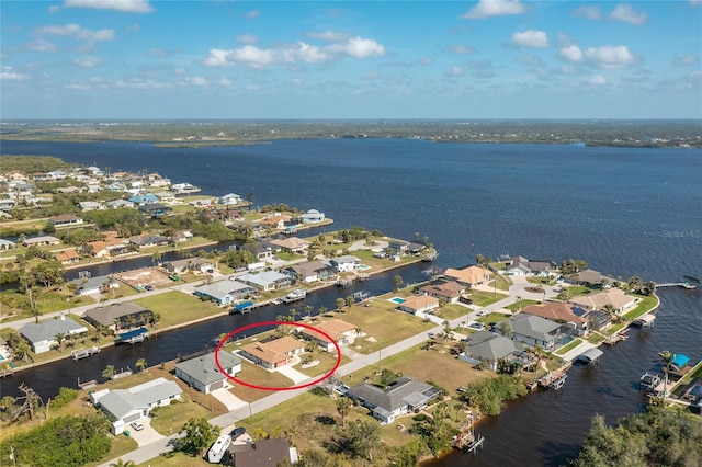 bird's eye view featuring a residential view and a water view