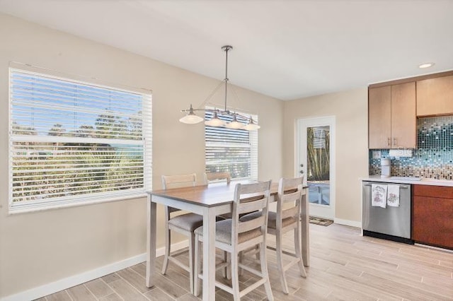 dining area with light wood-type flooring