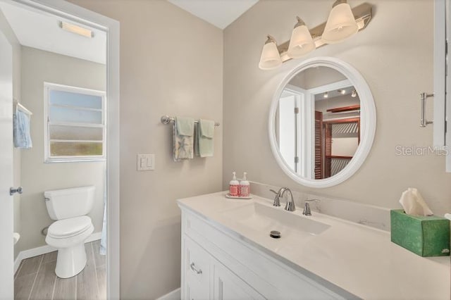 bathroom featuring vanity and toilet