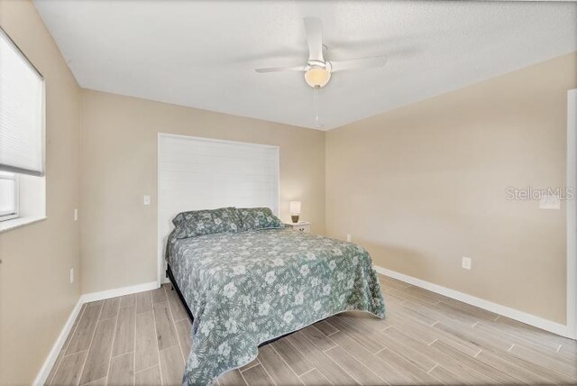 1493 Janet Pl, Englewood, FL 34223 - bedroom with wood tiled floors and ceiling fan