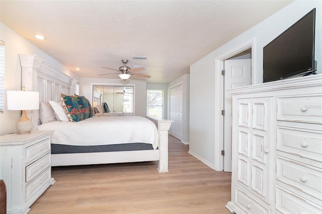 bedroom with ceiling fan and light wood-type flooring