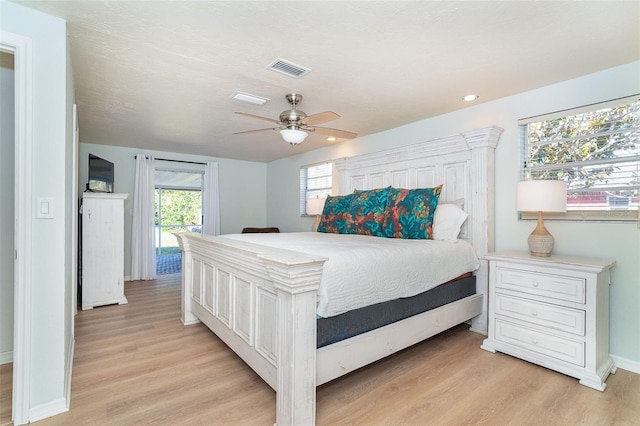 bedroom with ceiling fan and light wood-type flooring