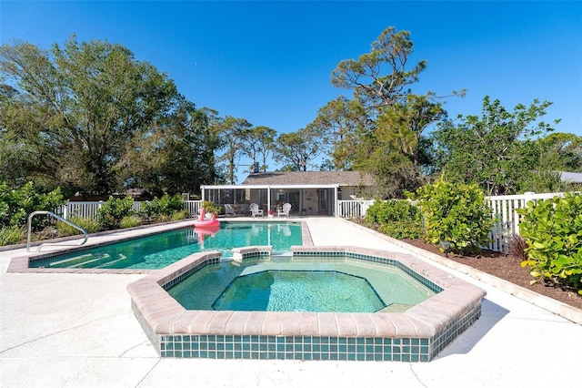 view of swimming pool with an in ground hot tub and a patio area