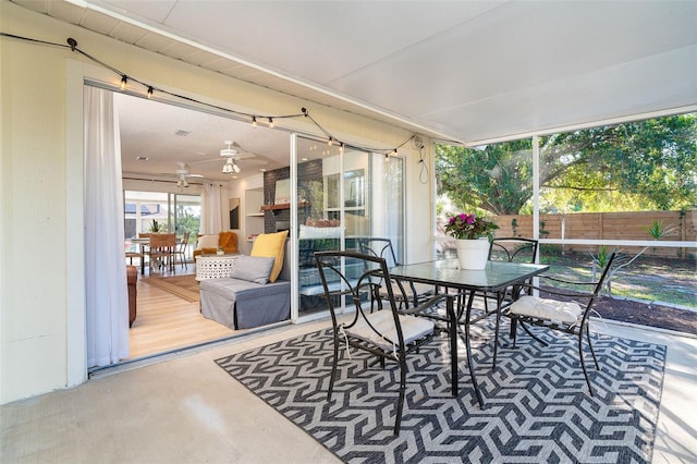 sunroom / solarium with ceiling fan