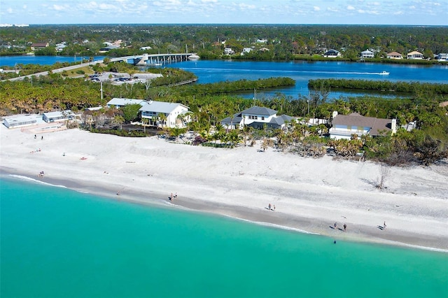 aerial view with a water view and a view of the beach