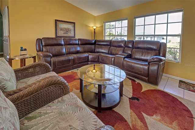 tiled living room with lofted ceiling