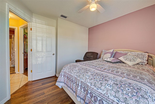 bedroom with ceiling fan and dark wood-type flooring