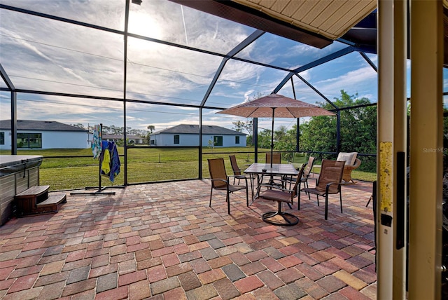 view of patio / terrace with a lanai