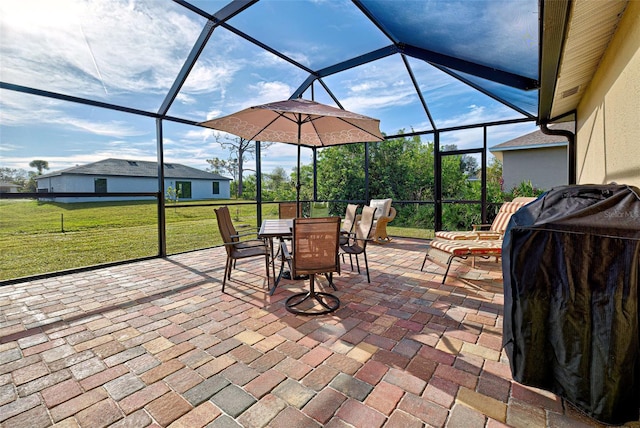 view of patio with glass enclosure