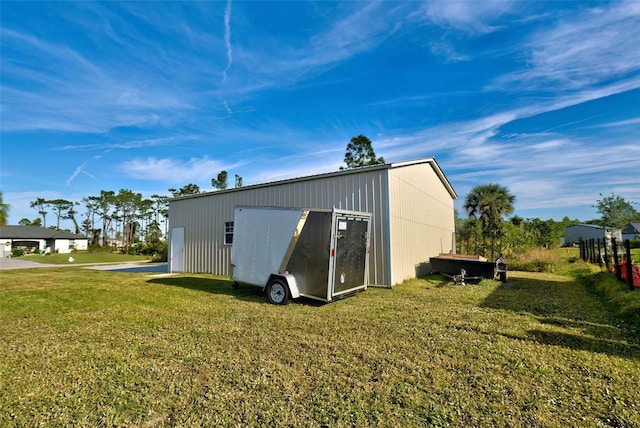 view of outbuilding with a lawn