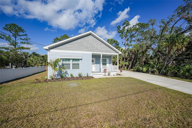 view of front of home featuring a front lawn and a porch