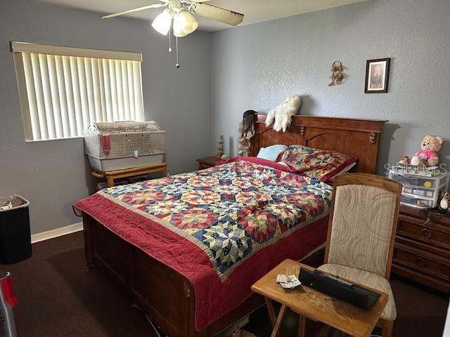 carpeted bedroom with ceiling fan