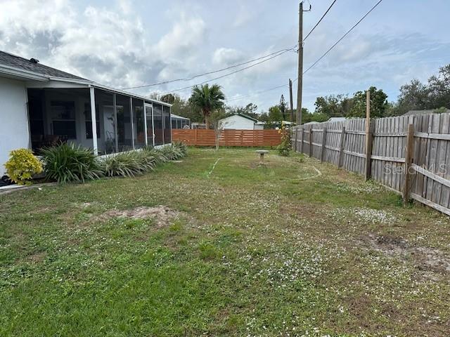 view of yard featuring a sunroom