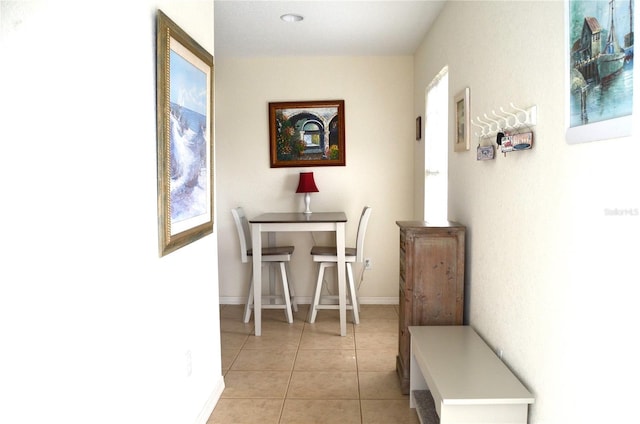 hallway with light tile patterned floors