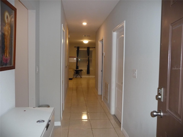 hallway with light tile patterned flooring