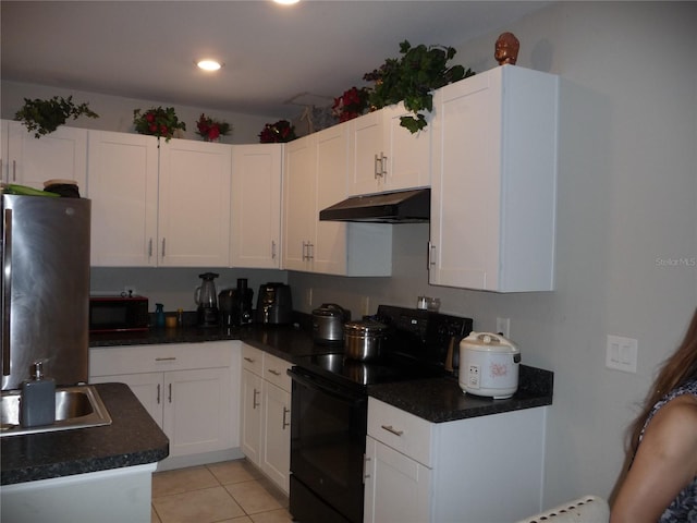 kitchen with black appliances, white cabinetry, sink, and light tile patterned floors