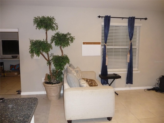 sitting room featuring light tile patterned floors