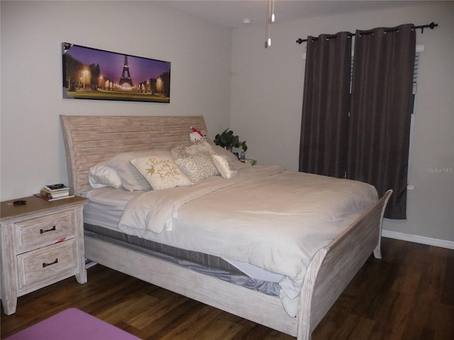 bedroom featuring dark hardwood / wood-style flooring