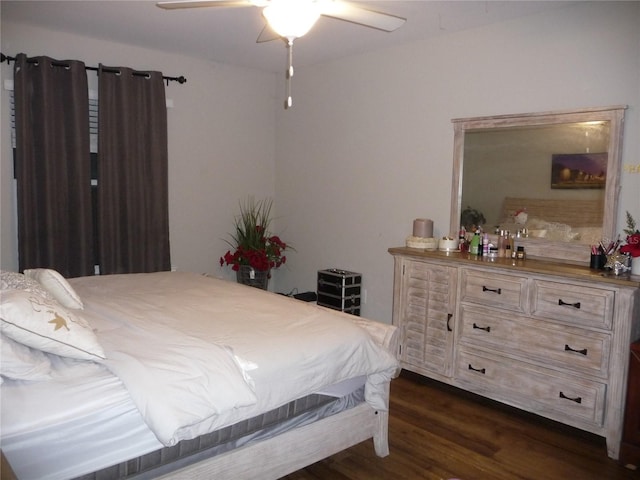 bedroom featuring ceiling fan and dark hardwood / wood-style flooring