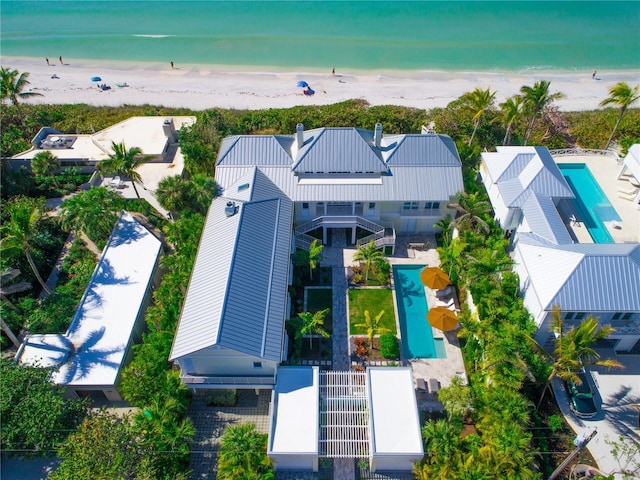 birds eye view of property featuring a view of the beach and a water view