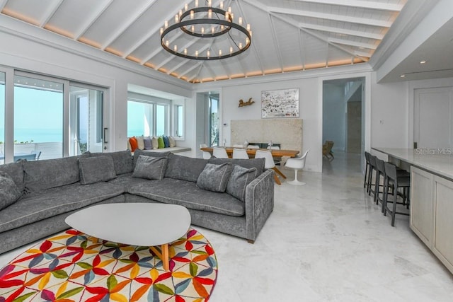 living room with lofted ceiling with beams and a notable chandelier