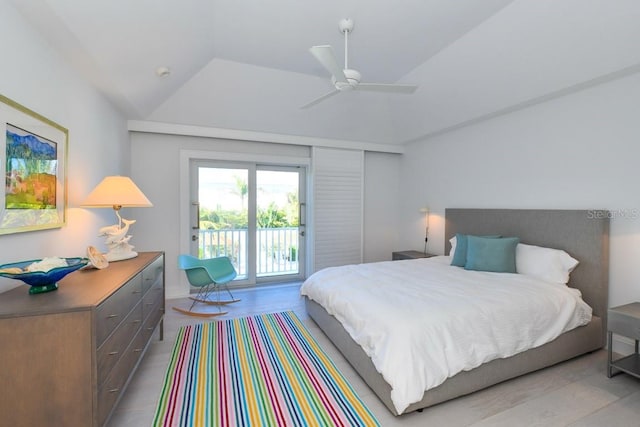 bedroom featuring access to outside, ceiling fan, vaulted ceiling, and light hardwood / wood-style floors