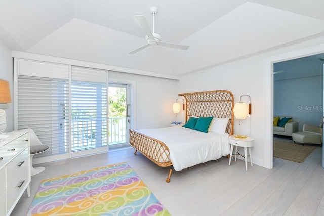 bedroom with light wood-type flooring, ceiling fan, vaulted ceiling, and access to outside