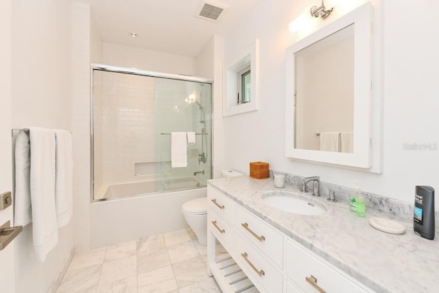 full bathroom with toilet, vanity, and combined bath / shower with glass door