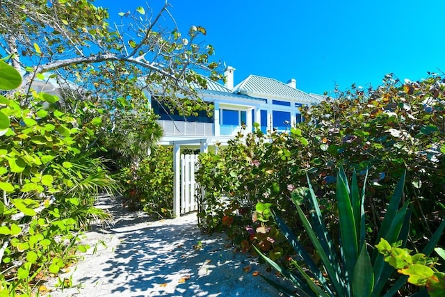 view of home's exterior featuring a balcony