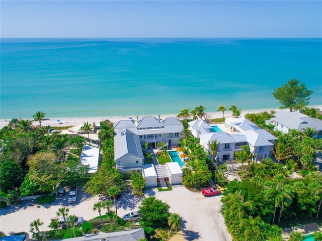 bird's eye view featuring a water view and a view of the beach