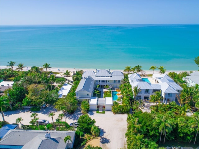 bird's eye view with a water view and a view of the beach