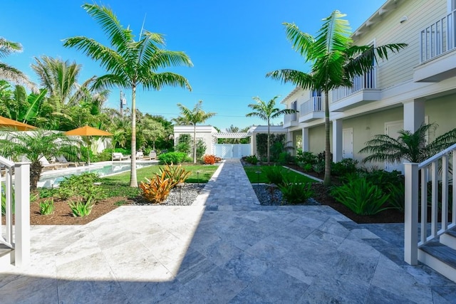 surrounding community featuring a patio and a swimming pool