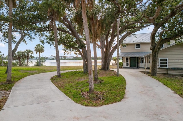 view of front of house featuring a porch and a water view